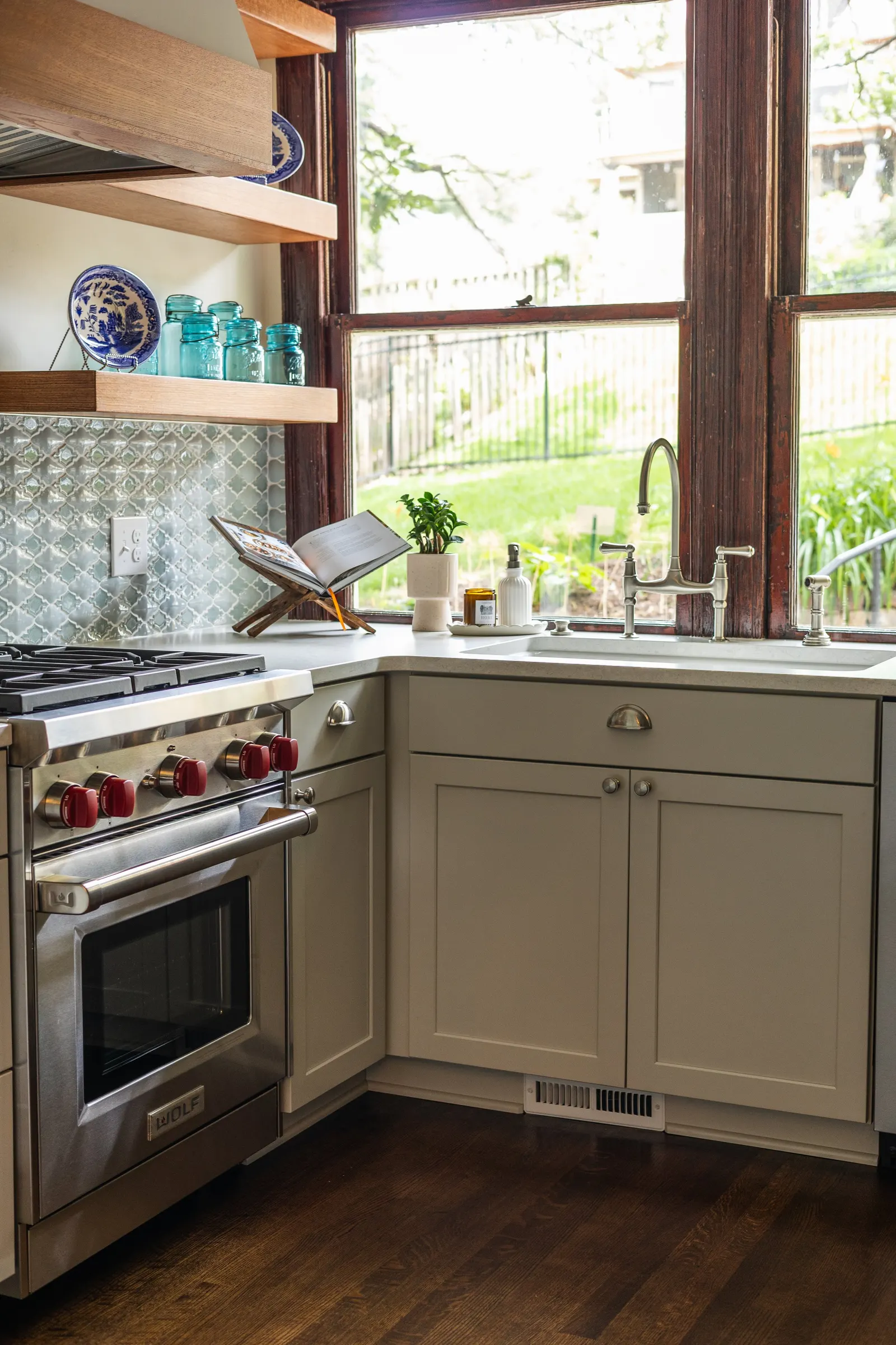 Finished kitchen remodel with island and ceiling-height cabinets