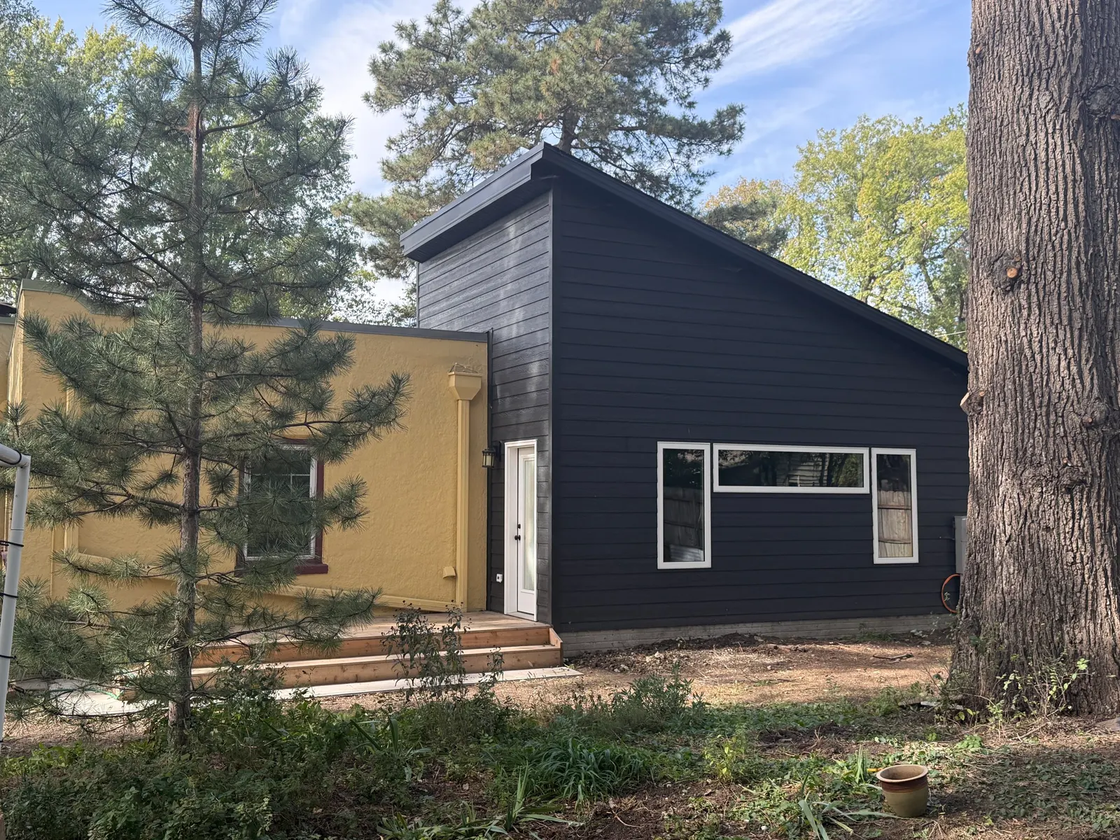 Pitched roofline and exterior tie-in on a 1930 Lincoln home addition