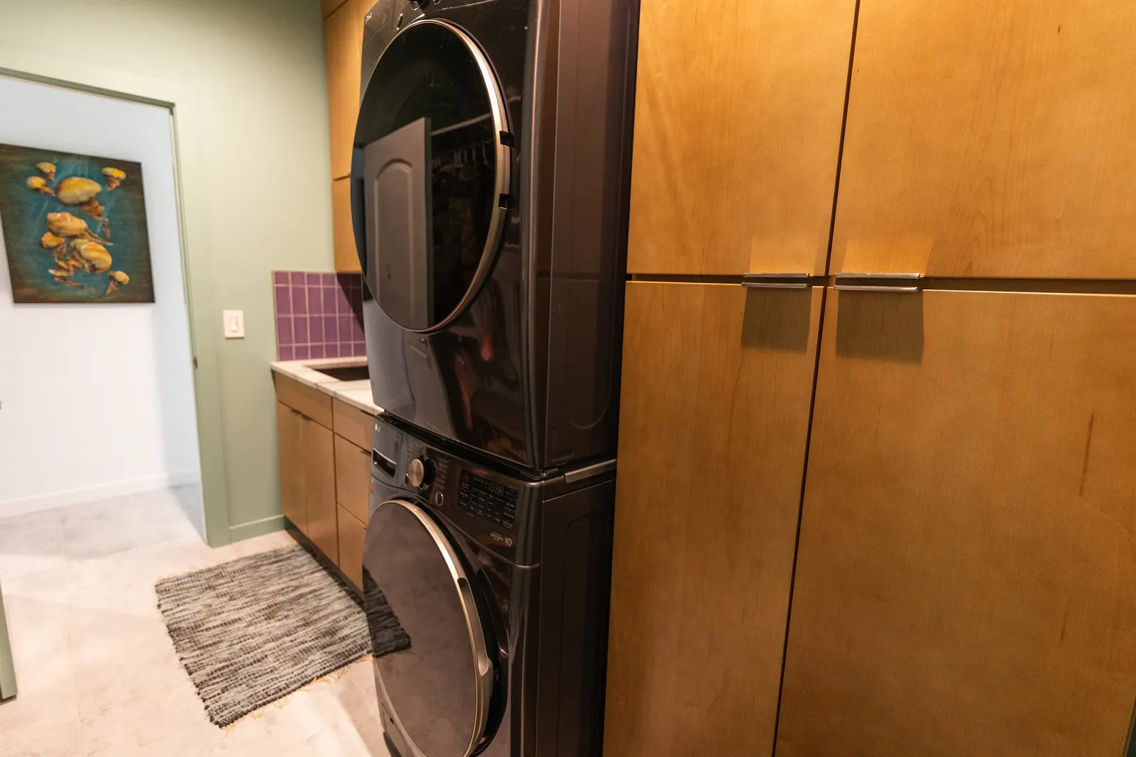2007 Mudroom Remodel, laundry room, color drenching, custom wood cabinets, quartz countertop, purple subway tile backsplash, laundry room solutions, brushed nickel hardware.