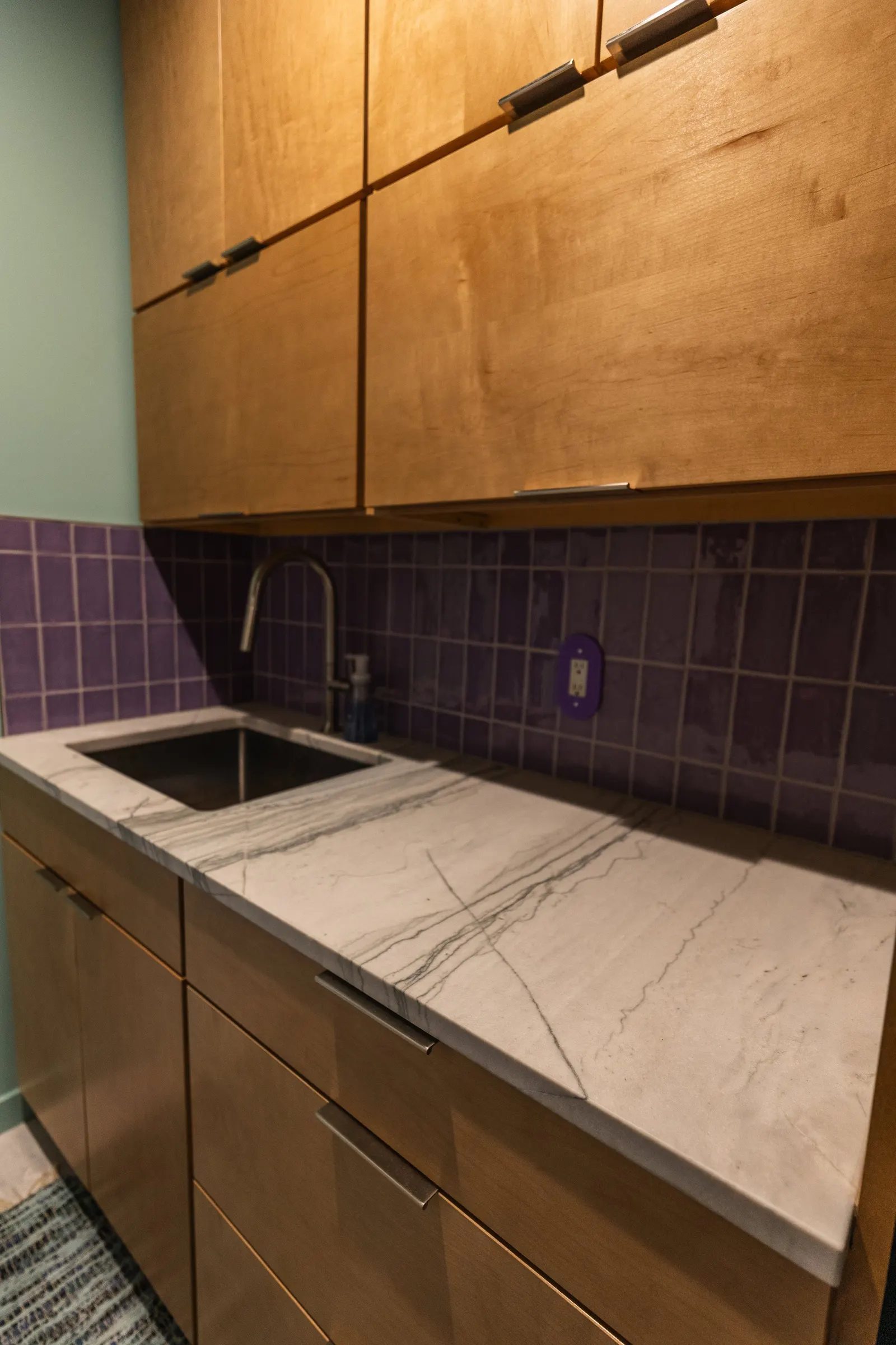 2007 Mudroom Remodel, laundry room, color drenching, custom wood cabinets, quartz countertop, purple subway tile backsplash, laundry room solutions, brushed nickel hardware.