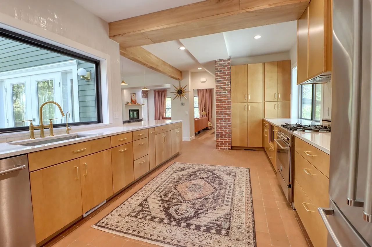 Forest House Kitchen Remodel, Whole Home Remodel, gold hardware, boho chic, farmhouse sink, custom hood, custom wood cabinets, tile floor, stainless steel appliances, white quartz countertops, large windows, wood beams, craftsmanship.